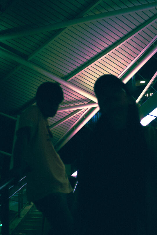 Alternative band The Standby dimly lit on a set of stairs